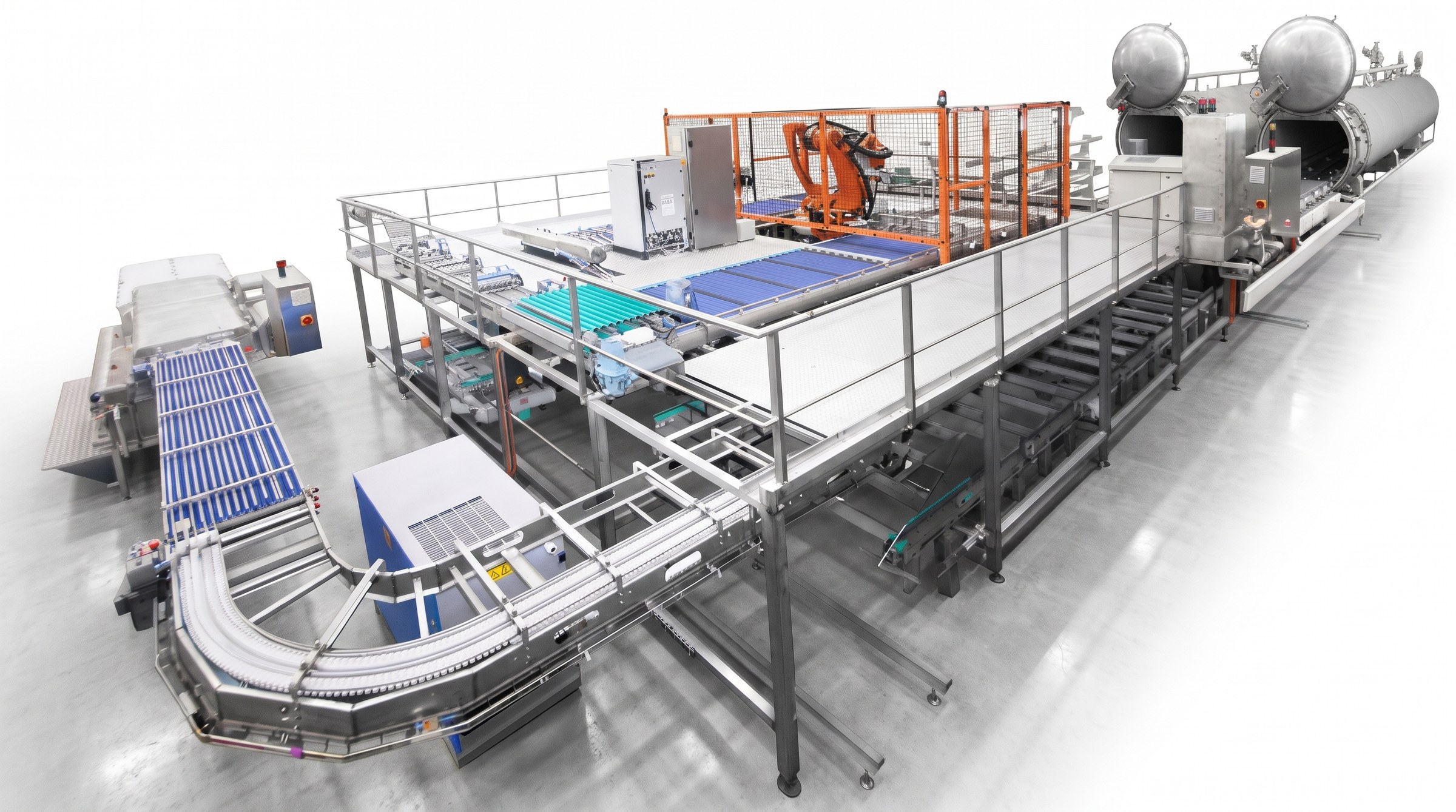 Render 3D de la línea de esterilización automatizada TACORE con robot y autoclaves